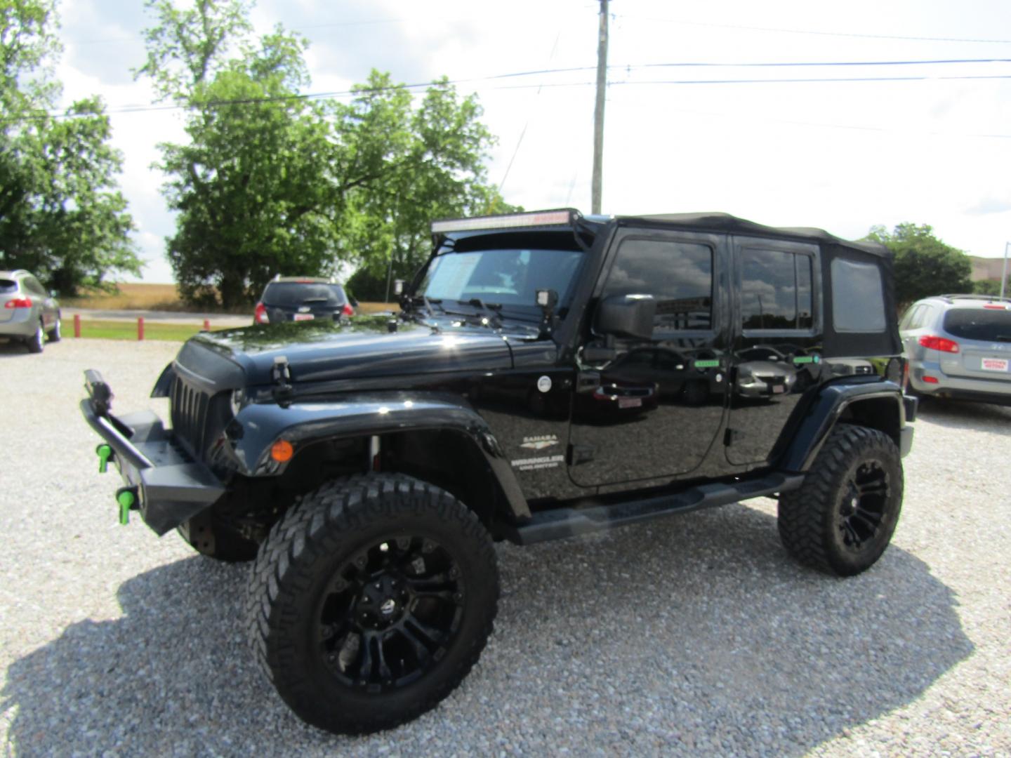 2015 Black /Tan Jeep Wrangler (1C4HJWEG4FL) with an V6 engine, Automatic transmission, located at 15016 S Hwy 231, Midland City, AL, 36350, (334) 983-3001, 31.306210, -85.495277 - Photo#2